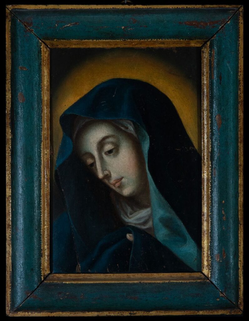 A 17th-century Italian School painting depicting the Virgin Mary as Mater Dolorosa, shown with a sorrowful expression, wearing a deep blue mantle against a golden halo.